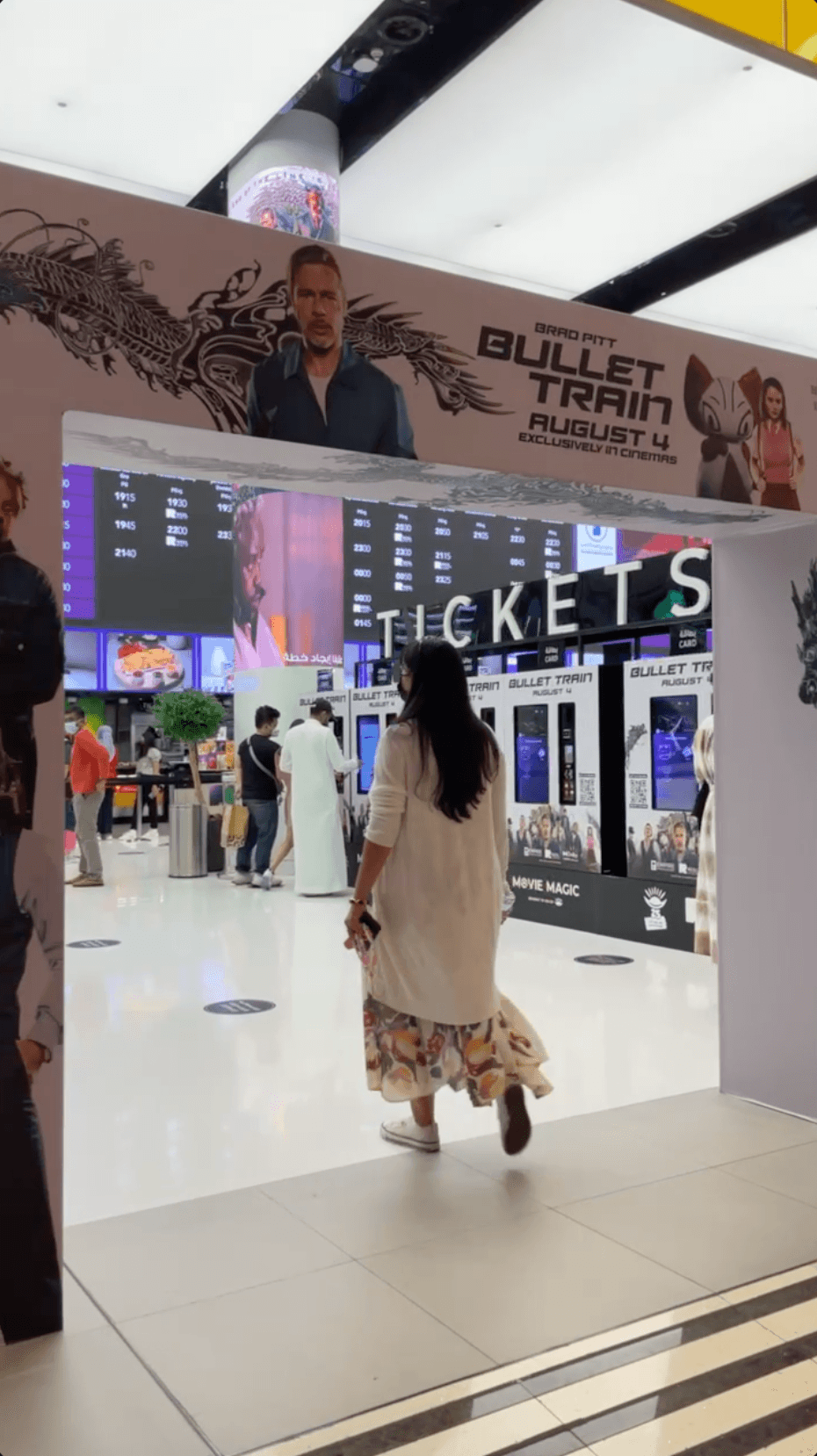 Moviegoer enters a cinema Moviegoer enters a cinema